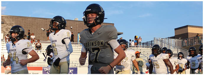 A football player wearing a blue and white uniform. Description generated by AI