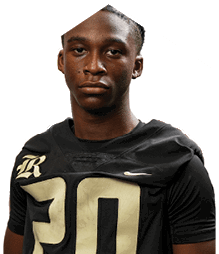 A young man wearing a white jersey with the number 10 on it. Description generated by AI