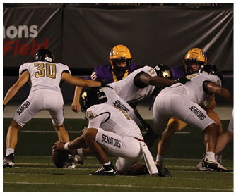 A football player running on the field. Description generated by AI
