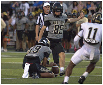 A football player running on the field. Description generated by AI