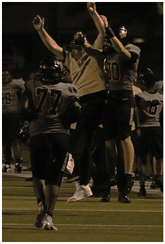 A football player running on the field. Description generated by AI