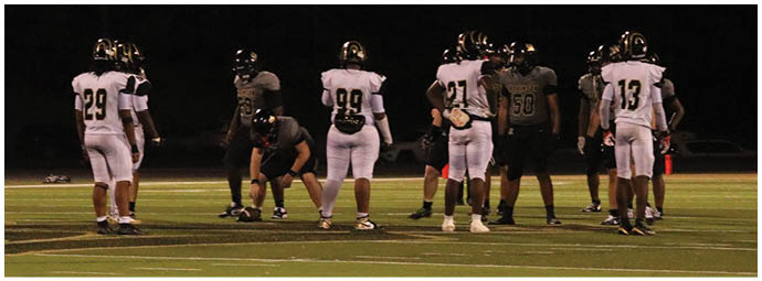 A football player is sliding on the ground. Description generated by AI