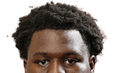 A young man wearing a white jersey with the number 10 on it. Description generated by AI