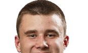 A young man wearing a white jersey with the number 10 on it. Description generated by AI