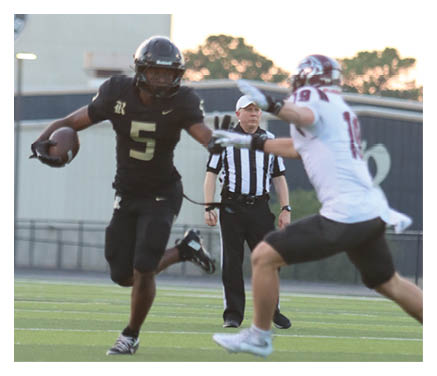 A group of young men wearing black jerseys with the word “Vista" on the front are celebrating a victory. AI generated content