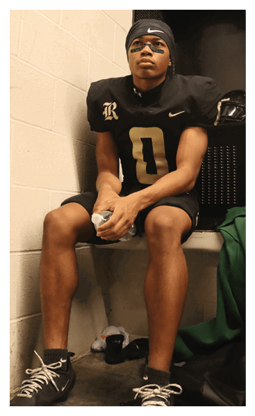 A young man wearing a football jersey with the name Vista on the back. AI generated content