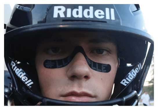 A group of football players wearing headphones and smiling. AI generated content