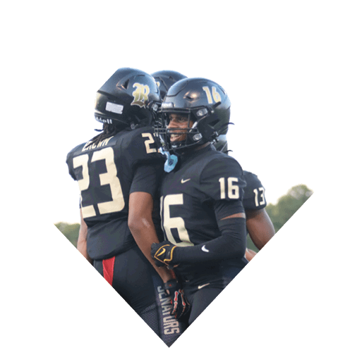 A football player wearing a black jersey with the number 10 sits on the ground with a football helmet on the ground next to him. AI generated content