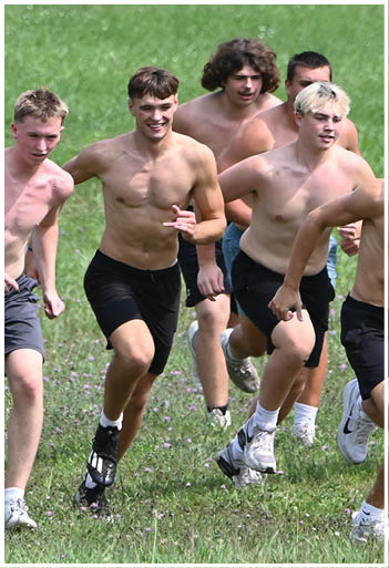 A football player running on the field. Description generated by AI
