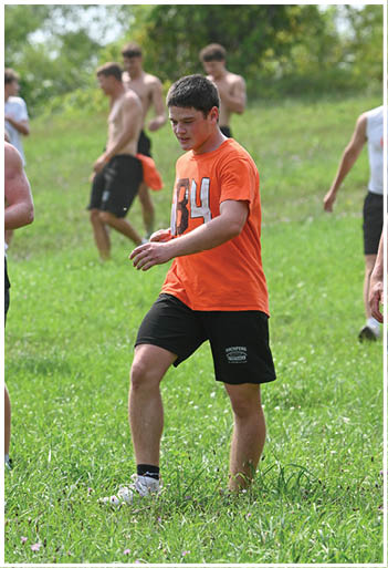 A football player running on the field. Description generated by AI