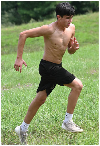 A football player running on the field. Description generated by AI
