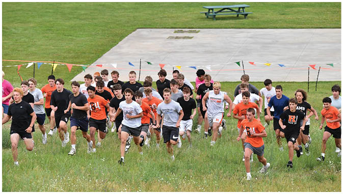 A group of football players on a field. Description generated by AI