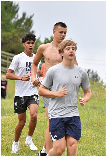 A football player running on the field. Description generated by AI