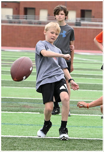 A football player running on the field. Description generated by AI