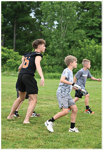A football player running on the field. Description generated by AI
