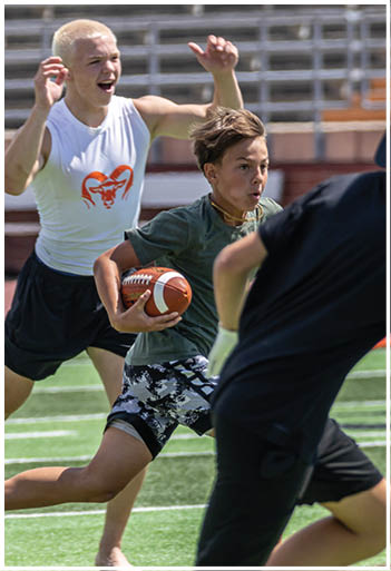 A football player running on the field. Description generated by AI