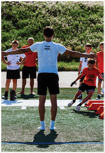 A football player running on the field. Description generated by AI