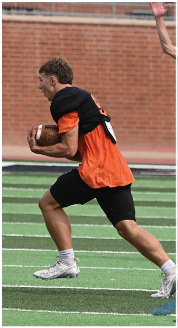 A football player wearing a blue jersey with the number 58 on it. Description generated by AI