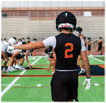 A football player wearing a blue jersey with the number 58 on it. Description generated by AI
