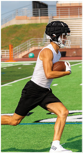 A football player wearing a blue jersey with the number 58 on it. Description generated by AI