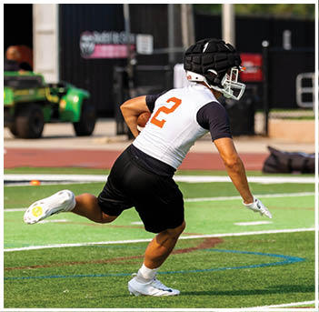 A football player wearing a blue jersey with the number 58 on it. Description generated by AI