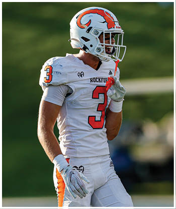 A group of football players celebrating a touchdown. Description generated by AI