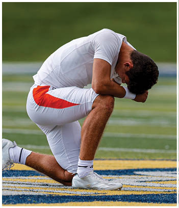 A football player wearing a blue jersey with the number 58 on it. Description generated by AI