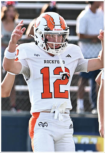 A group of football players celebrating a touchdown. Description generated by AI