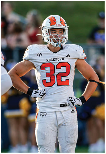 A group of football players celebrating a touchdown. Description generated by AI