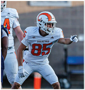 A group of football players celebrating a touchdown. Description generated by AI