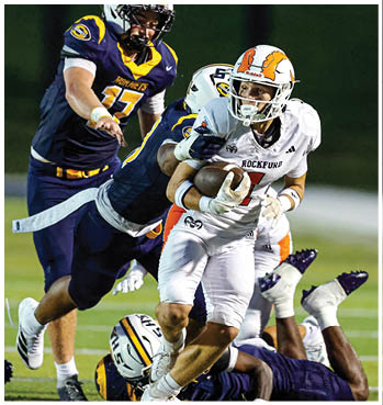 A group of football players celebrating a touchdown. Description generated by AI
