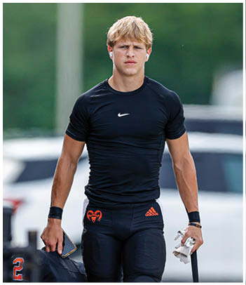 A football player wearing a blue jersey with the number 58 on it. Description generated by AI