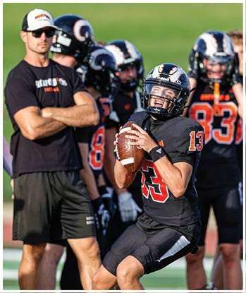 A group of football players celebrating a touchdown. Description generated by AI
