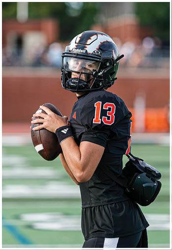 A group of football players celebrating a touchdown. Description generated by AI