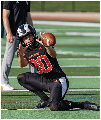 A group of football players celebrating a touchdown. Description generated by AI