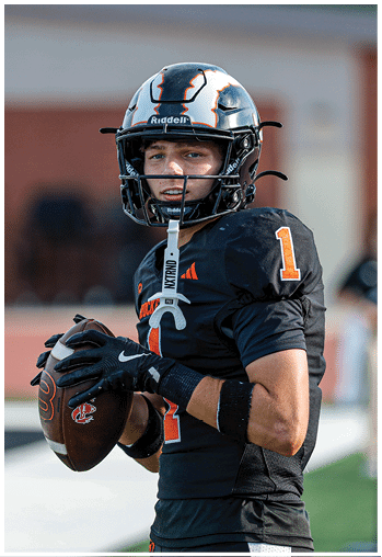 A group of football players celebrating a touchdown. Description generated by AI