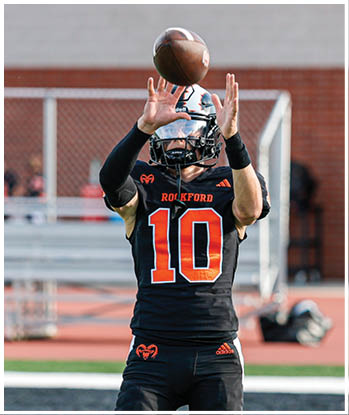 A group of football players celebrating a touchdown. Description generated by AI