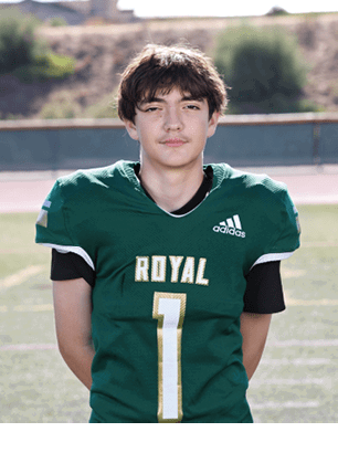 A young man wearing a white and black jersey with the number 14 on it. Description generated by AI