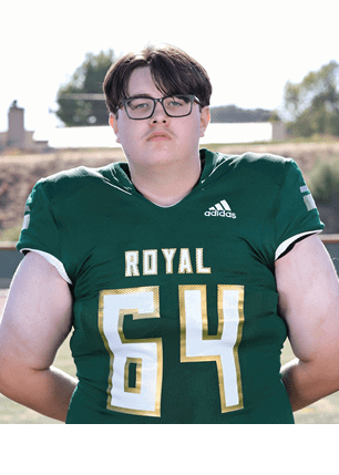 A young man wearing a white and black jersey with the number 14 on it. Description generated by AI