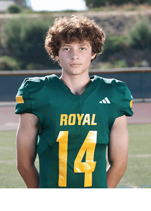 A young man wearing a white and black jersey with the number 14 on it. Description generated by AI