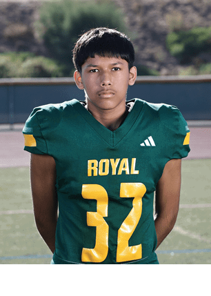 A young man wearing a white and black jersey with the number 14 on it. Description generated by AI