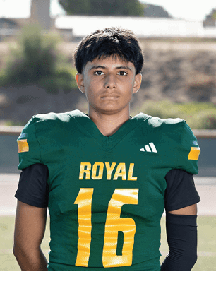 A young man wearing a white and black jersey with the number 14 on it. Description generated by AI