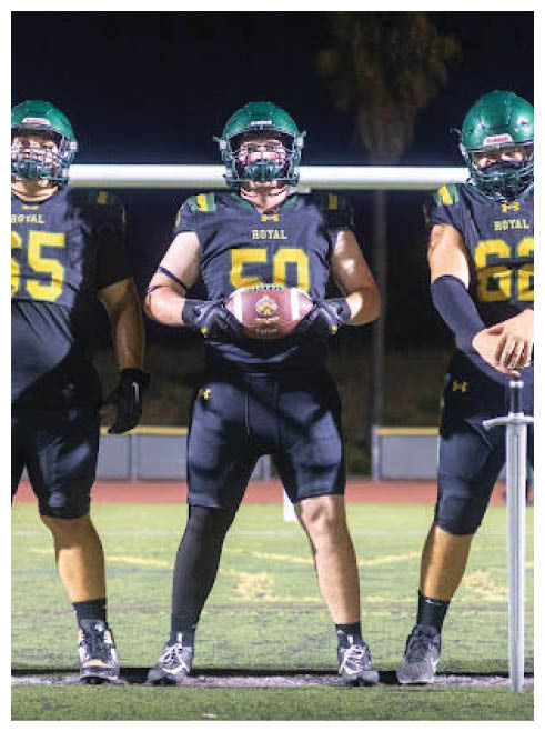 Two football players wearing black jerseys and holding hands. Description generated by AI