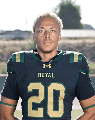 A young man wearing a white and black jersey with the number 14 on it. Description generated by AI