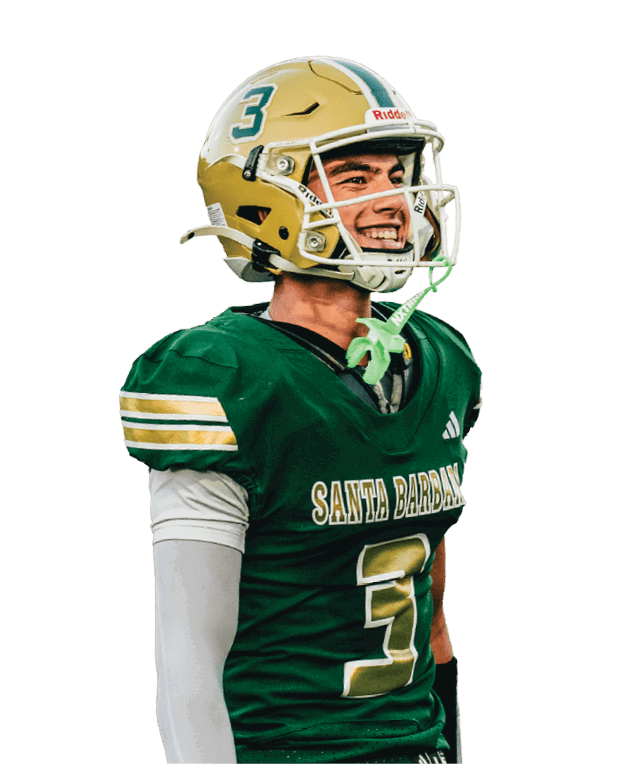 A person wearing a green football jersey with “Santa Barbara" written on it and a gold helmet with the number three is smiling. Description generated by AI