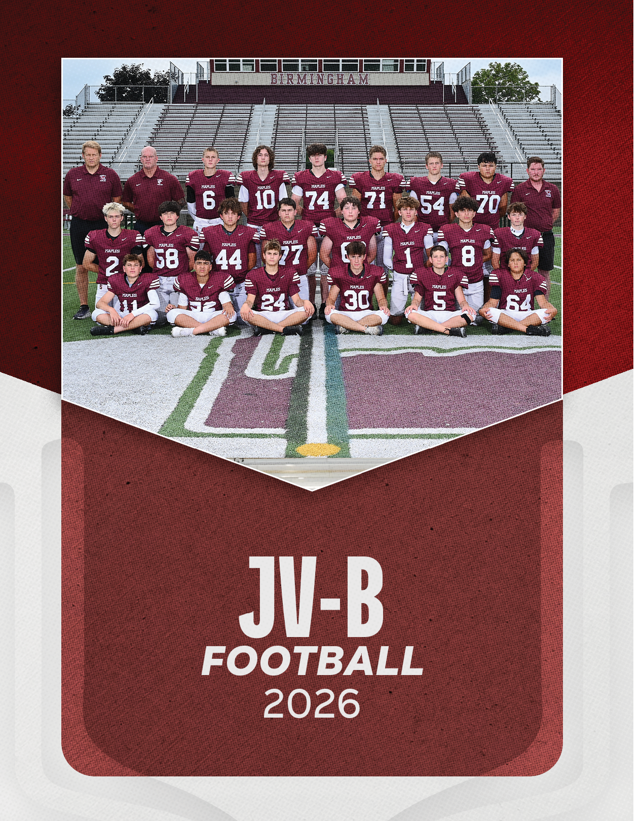 A group of football players sitting on a bench. Description generated by AI