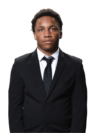 A young man wearing a white and black jersey with the number 14 on it. Description generated by AI
