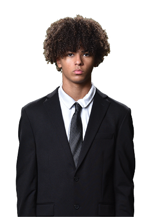 A young man wearing a white and black jersey with the number 14 on it. Description generated by AI