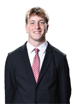 A young man wearing a white and black jersey with the number 14 on it. Description generated by AI