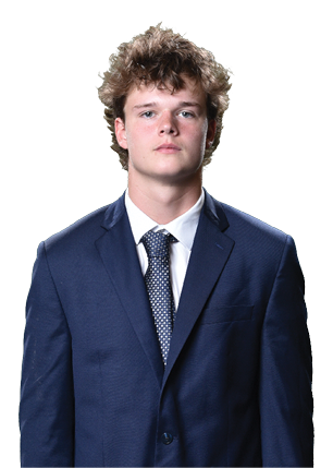 A young man wearing a white and black jersey with the number 14 on it. Description generated by AI